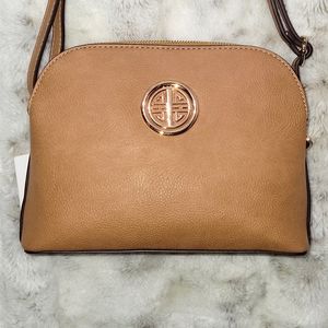 Taupe color crossbody purse with 3 compartments. Also shoulder bag.